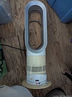 Full top-down view of the Dyson bladeless fan and heater unit showing the entire device including the air loop and base with control buttons.