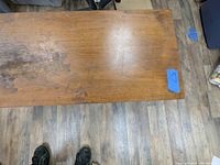Top view of the cedar chest showing wood surface with wear and discoloration.