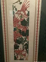 Full view of vertical intaglio print depicting hummingbirds and flowers with detailed colors and hand-embossed paper.