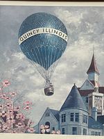 Framed vintage 1982 Dogwood Days poster showing blue hot air balloon with "Quincy Illinois" text, town scenery with Victorian buildings and flowering trees.