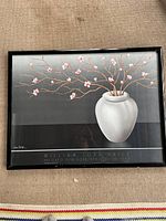 Full view of framed poster showing artwork, frame and text details.