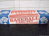 Original box of 1988 Topps baseball card complete set lying flat, showing box design with BASEBALL CARD SET text in red, white and blue.