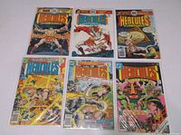 Photo showing six Hercules Unbound comic books from DC Comics with colorful illustrated covers, all bagged and boarded.