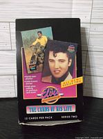 Box displaying single pack of Elvis Series Two trading cards, showing promotional images and text about the cards included.