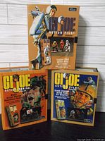 Three boxed G.I. Joe 3-piece sets showing the front cover artwork and packaging.