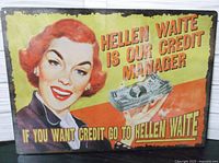 Front view of vintage metal sign showing woman holding money and text about credit manager Hellen Waite