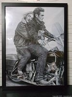 Framed black and white photo showing full image of James Dean and Marilyn Monroe on the motorcycle.