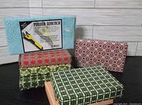 Multiple pre wrapped gift boxes including a boxed Power Wrench