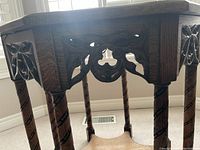 Close-up of carved apron and barley twist leg