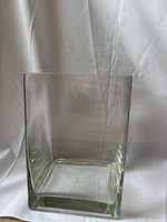 Full view of the clear large square glass vase showing its transparency and condition.