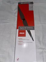 Front of the refurbished RCA digital flat antenna box showing product image and key features such as HDTV 1080i, receiving local HDTV/UHF signals, improved reception, and no external power needed.