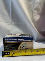 Box of Third Hand Tool with 2X Magnifier showing product details and tape measure indicating size.
