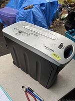 Black & Decker paper and CD shredder showing top control panel, slots for paper and CD, and unit body with slight age wear.