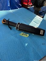 Fiskars Primegrip garden cutting knife sheathed on blue textured cloth with tag #84