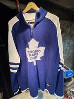 Front view of the Toronto Maple Leafs sweater showing logo and sleeve design.
