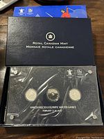 Set of three sterling silver coins displayed in the Royal Canadian Mint plastic case with Olympic logos and event details.