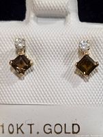 Front view of the earrings showing 10K gold stamp and the square cut tourmaline and round diamond stones.