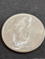 Obverse side of 1965 Canadian 50 cents silver coin showing Queen Elizabeth II profile.