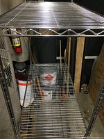 Close-up of two wire shelves showing robust chrome plating and spacing, confirming adjustable shelving capability.