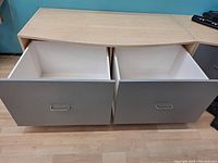 Top view with both large grey drawers fully open showing spacious white drawer interiors and heavy-duty slides.