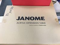 Closed box labeled Janome Acrylic Extension Table, marked for HD3000 and HD5000 models