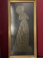 Front view of the framed brass rubbing depicting Lady Margaret Peyton in detailed period attire.