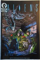 Color photo of Aliens #1 comic cover showing two soldiers in green suits and two aliens.