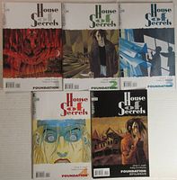 Photo showing first five issues with cover art from House of Secrets 2nd Series, depicting dark, surreal artwork related to Foundation storyline.