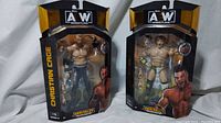 Front view of both AEW wrestling figures in packaging, showing Christian Cage and Brian Cage characters from Series 9