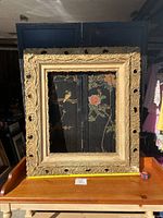The full front view of the large rectangular antique wooden frame showing intricate detailed carvings and distressed finish.