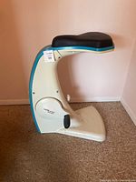 Side view of the Sit N Cycle exercise bike with visible padded seat and pedals.