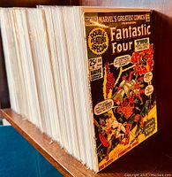 Stack of bagged and boarded comic books showing Fantastic Four #30 at front