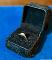 Full view of ring in black velvet box