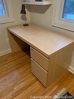 Full side view of the Ikea MALM desk showing the work surface and drawers.