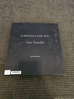 Front cover of the first hardcover book with title and author name visible