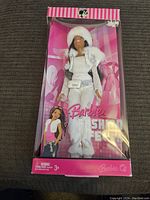 Full packaged doll in box showing front view with Barbie Fashion Fever branding.