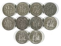 Reverse sides of 10 Roosevelt dimes showing torch and branches design.