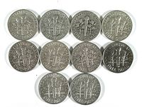 Reverse side of ten Roosevelt dimes showing the torch design and inscriptions, silver coins from 1940s to 1960s.