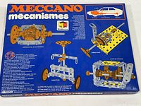 Top view of the box lid showing Meccano branding and mechanical diagram illustrations.