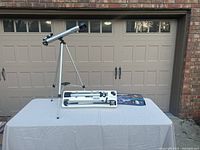 Vivitar telescope fully assembled on tripod showing size and metal finish.