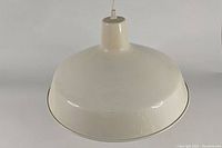 Top and side view of the off-white industrial pendant lamp showing the dome-shaped metal shade.