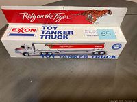 Top and side view of the Exxon Toy Tanker Truck box showing 'Rely on the Tiger' branding and picture of the toy truck with tiger design.