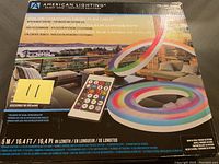 Photo of unopened American Lighting color changing neon flex light box showing product image and remote control picture on front of box.