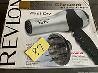 Revlon hair dryer box showing product and its features including matte chrome finish, 1875 watt power, and included diffuser.