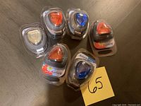 Six sealed Refresh mini car diffusers arranged in two photos with visible different gel colors and packaging details.