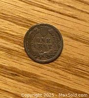 Reverse side showing 'ONE CENT' surrounded by a wreath on the penny.