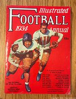 Front cover showing red background with two vintage football players and title 'Football Illustrated 1934 Annual'.