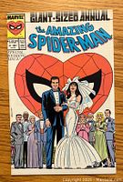 Front cover of The Amazing Spider-Man Annual #21 comic book showing wedding scene of Peter Parker and Mary Jane Watson.