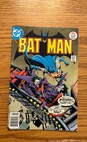 Front cover of Batman #286 comic book showing Batman and Joker in fight scene. Cover has stains and visible wear.
