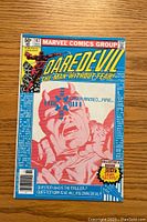Front cover of Daredevil #167 comic book, showing the issue details, cover price, Marvel Comics branding, and artwork featuring a man targeted with a laser sight.